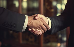 Image of professionals shaking hands